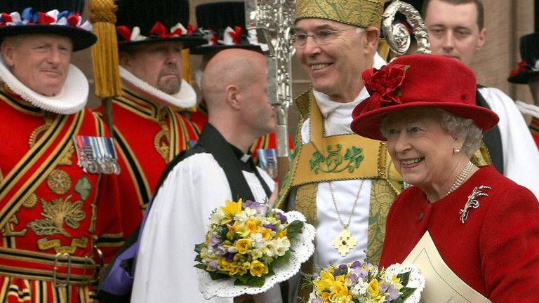 Queen Elizabeth II walks with Archbishop Alan Harper after the Maundy service at St Patrick&#39;s Cathedral in March 2008. Pic: AP