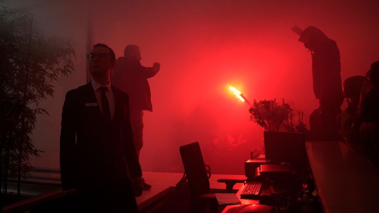 Striking railway workers invade French luxury group LVMH&#39;s headquarters, Thursday, April 13, 2023 in Paris. Protesters opposed to President Emmanuel Macron&#39;s unpopular plan to raise the retirement age in France marched Thursday in cities and towns around France in a final show of anger before a decision on whether the measure meets constitutional standards. (AP Photo/Lewis Joly)