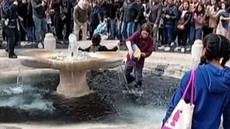 Climate activists in Italy poured black liquid into a fountain in Rome.