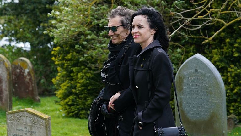 Ronnie and Sally Wood arriving for the funeral of Paul O&#39;Grady at St Rumwold&#39;s Church in Aldington, Kent. Picture date: Thursday April 20, 2023.