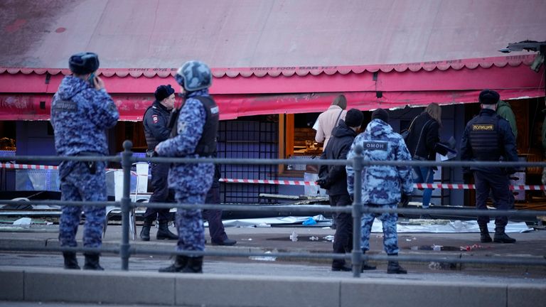 Russian police officers stand at the side of an explosion at a cafe in St. Petersburg, Russia, Sunday, April 2, 2023. An explosion tore through a cafe in the Russian city of St. Petersburg on Sunday, and preliminary reports suggested a prominent military blogger was killed and more than a dozen people were injured. Russian news reports said blogger Vladlen Tatarsky was killed and 15 people were hurt in the explosion at the "Street Bar" cafe in Russia&#39;s second largest city. (AP Photo)
