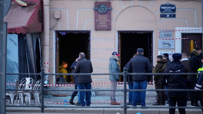 Russian investigators and police officers stand at the side of an explosion at a cafe in St. Petersburg, Russia, Sunday, April 2, 2023. An explosion tore through a cafe in the Russian city of St. Petersburg on Sunday, and preliminary reports suggested a prominent military blogger was killed and more than a dozen people were injured. Russian news reports said blogger Vladlen Tatarsky was killed and 15 people were hurt in the explosion at the "Street Bar" cafe in Russia&#39;s second largest city. (AP Photo)