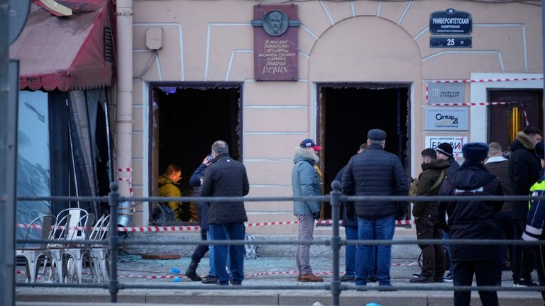 Russian investigators and police officers stand at the side of an explosion at a cafe in St. Petersburg, Russia, Sunday, April 2, 2023. An explosion tore through a cafe in the Russian city of St. Petersburg on Sunday, and preliminary reports suggested a prominent military blogger was killed and more than a dozen people were injured. Russian news reports said blogger Vladlen Tatarsky was killed and 15 people were hurt in the explosion at the "Street Bar" cafe in Russia's second largest city. (AP Photo)