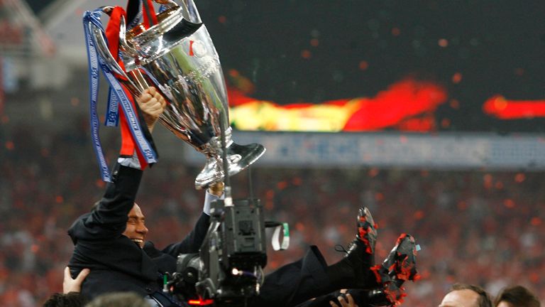 Former Italian Prime Minister Silvio Berlusconi lifts the trophy after AC Milan defeated Liverpool in the Champions League final soccer match in Athens May 23, 2007.