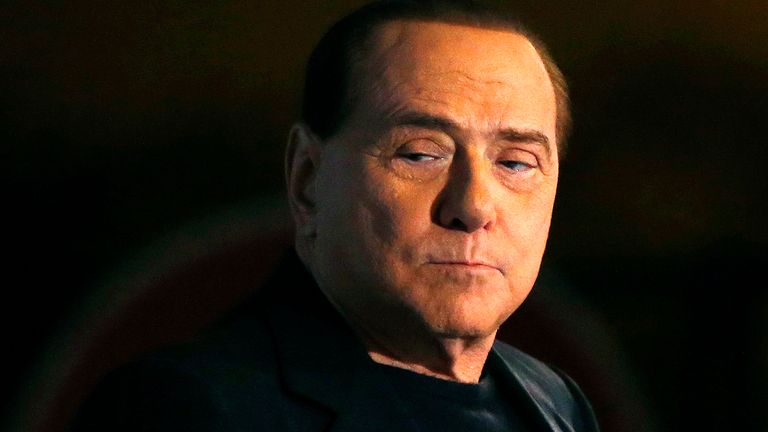 Former Prime Minister Silvio Berlusconi looks on during a speech from the stage in downtown Rome November 27, 2013. The Italian Senate opened its debate on expelling Silvio Berlusconi on Wednesday, ahead of an evening vote that is expected to see the veteran centre-right leader stripped of his seat in parliament over a tax fraud conviction.   REUTERS/Alessandro Bianchi (ITALY - Tags: POLITICS)
