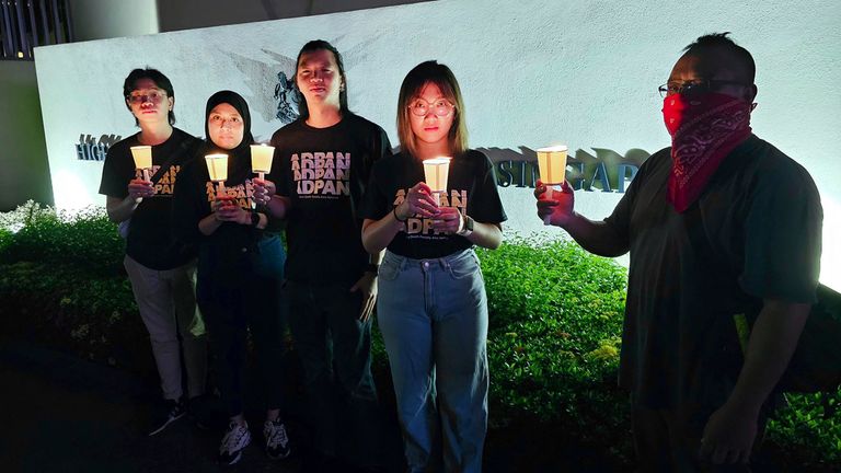 In this image taken and provided by Anti-Death Penalty Asia Network, members of Anti-Death Penalty Asia Network (ADPAN) hold candle outside Singapore Embassy in Kuala Lumpur, Malaysia Wednesday, April 26, 2023. Singapore on Wednesday executed a man accused of coordinating a cannabis delivery, despite pleas for clemency from his family and protests from activists that he was convicted on weak evidence. (Anti-Death Penalty Asia Network (ADPAN) via AP)