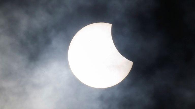 A rare hybrid solar eclipse is observed at Jakarta Planetarium in Jakarta, Indonesia, April 20, 2023. REUTERS/Ajeng Dinar Ulfiana
