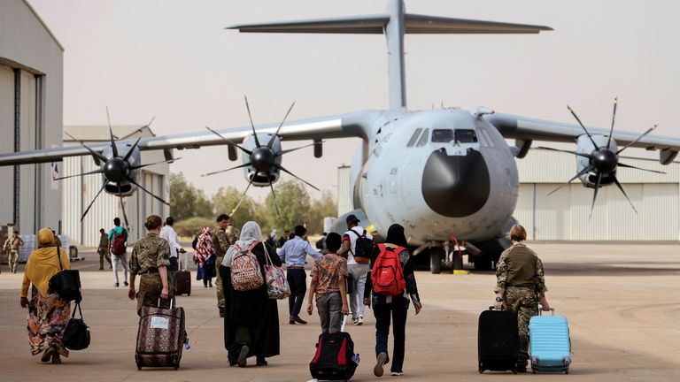 British nationals walk to board an RAF aircraft during the evacuation to Cyprus, at Wadi Seidna airport, Sudan April 26, 2023. Phot Arron Hoare/UK MOD/Handout via REUTERS THIS IMAGE HAS BEEN SUPPLIED BY A THIRD PARTY