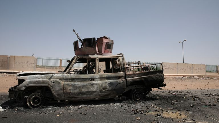 A destroyed military vehicle is seen in southern in Khartoum, Sudan, Thursday, April 20, 2023. The latest attempt at a cease-fire between the rival Sudanese forces faltered as gunfire rattled the capital of Khartoum. Through the night and into Thursday morning, gunfire could be heard almost constantly across Khartoum. (AP Photo/Marwan Ali)
