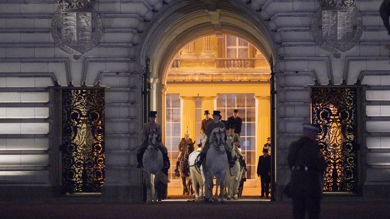 Members of the military on the Mall outside Buckingham Palace, central London, during a night time rehearsal for the coronation