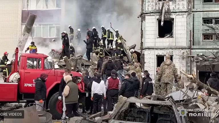 Firefighters work at an apartment building destroyed by a Russian attack in the town of Uman, around 215 kilometers (134 miles) south of Kyiv, Ukraine
Pic:National Police of Ukraine /AP
