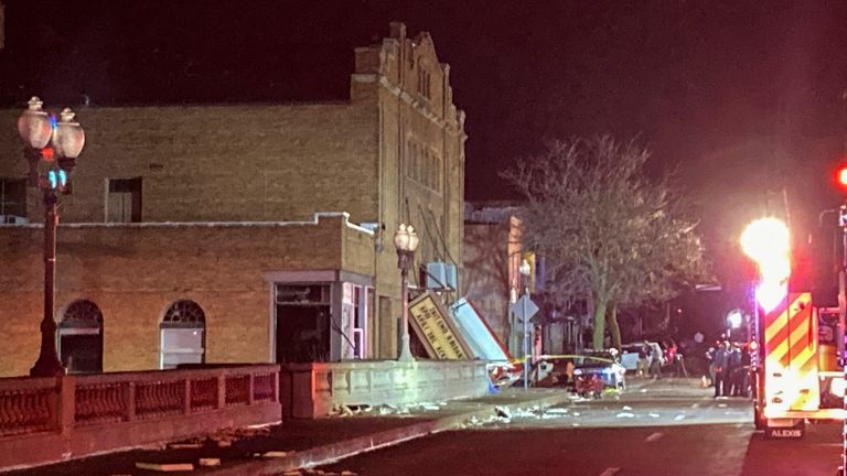 The fallen marquee is seen at the front entrance of the Apollo Theatre where a roof collapsed during a tornado in Belvidere, Ill., during a heavy metal concert, late Friday, March 31, 2023. Belvidere Fire Department Chief Shawn Schadle said 260 people were in the venue at the time. (AP Photo/Mattt Marton)