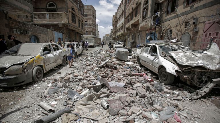 Yemenis inspect the site of a Saudi-led coalition airstrike in 2019. Pic: AP

