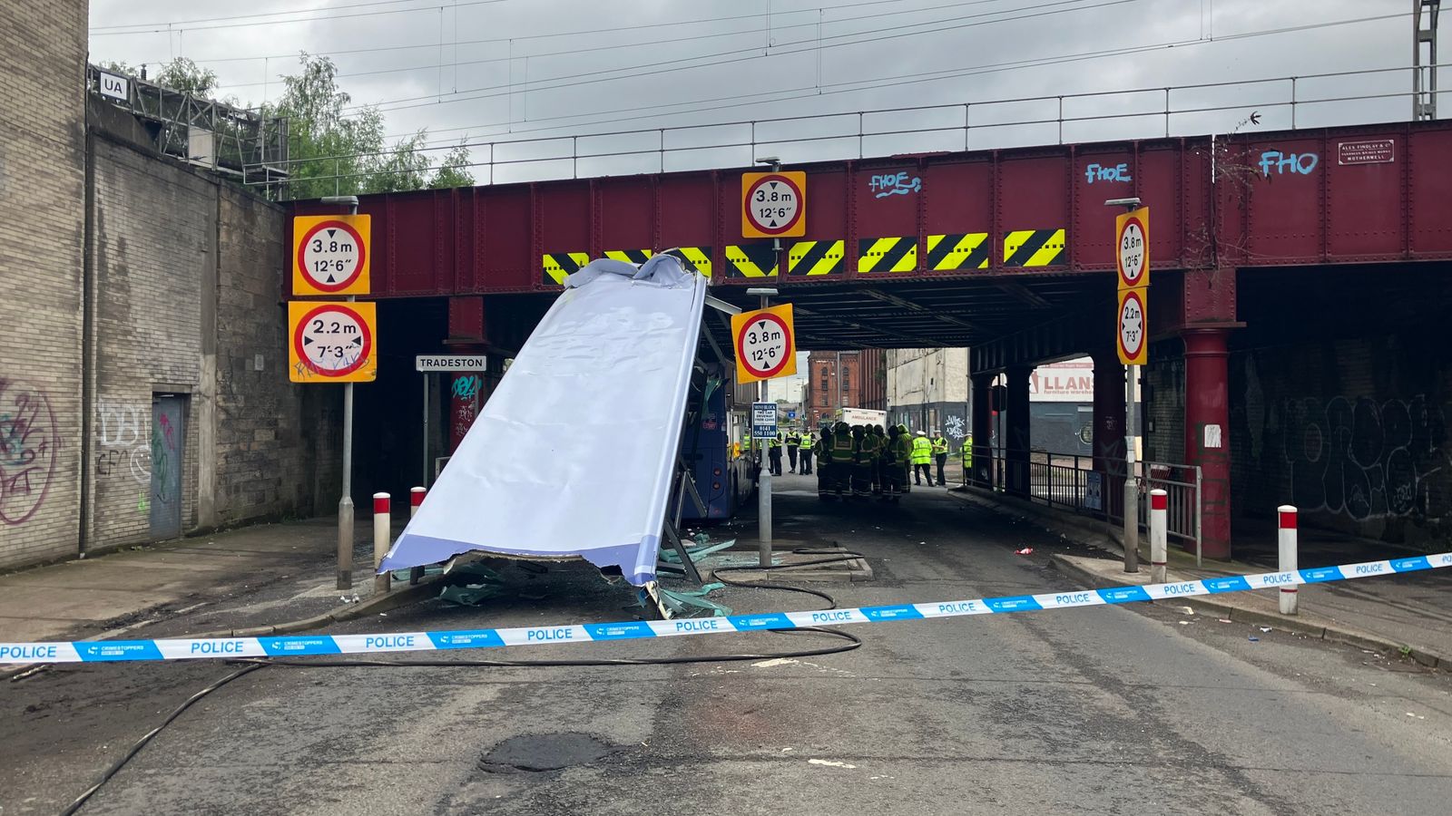 Ten in hospital as bus loses roof after hitting railway bridge in Glasgow 