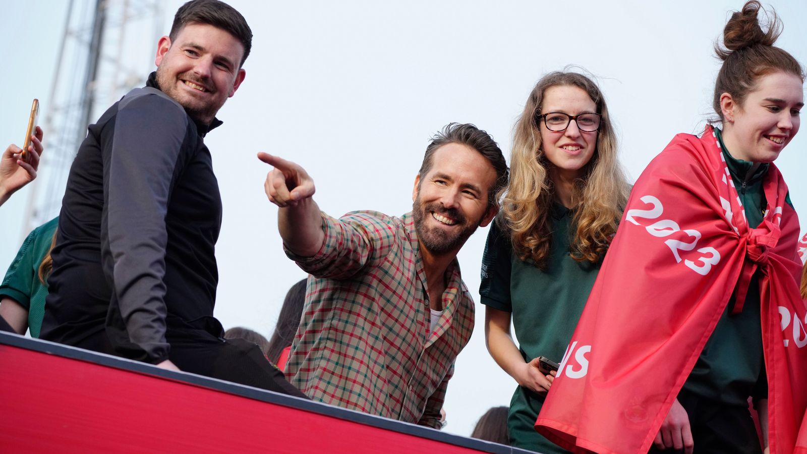 Ryan Reynolds and Rob McElhenney celebrate Wrexham AFC's promotion with bus parade
