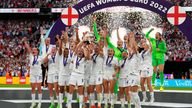 Leah Williamson, center left, and Millie Bright lift the trophy after winning the Women&#39;s Euro 2022 final. Pic: AP