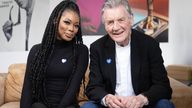 Sir Michael Palin photographed alongside Nafisat Ibrahim, a nurse whose childhood was impacted by a stammer