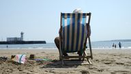 A sunbather soaks up some rays on the beach in Scarborough, North Yorkshire