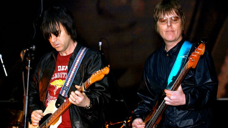 Former members of The Smiths, Andy Rourke (right) and Johnny Marr, on stage during the &#39;Manchester Versus Cancer&#39; charity concert