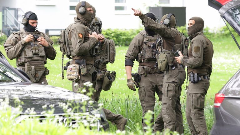 Police officers were seen gathered in front of the building.  Photo: AP