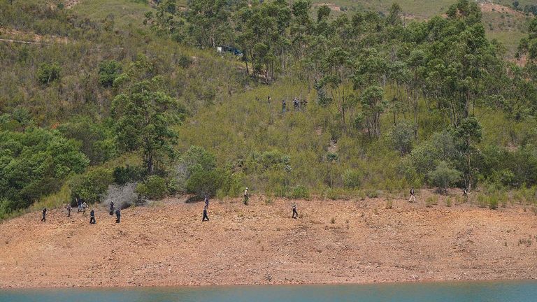 Personnel at Barragem do Arade reservoir, in the Algave, Portugal, as searches continue as part of the investigation into the disappearance of Madeleine McCann. The area is around 50km from Praia da Luz where Madeleine went missing in 2007. Picture date: Thursday May 25, 2023. PA Photo. See PA story POLICE Portugal. Photo credit should read: Yui Mok/PA Wire