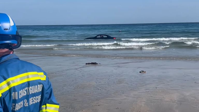 BMW washes out to sea at Trevaunance beach. Pic: St Agnes Coastguard Search and Rescue Team