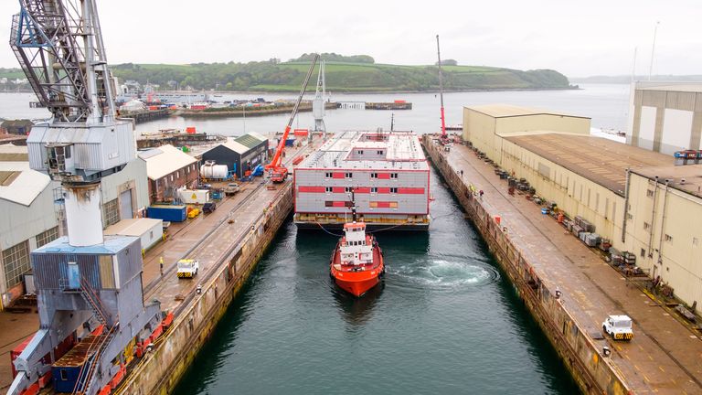 The Bibby Stockholm accommodation barge arrives into Falmouth docks, Cornwall, to undergo inspection. The 222-bedroom, three-storey vessel, will house around 500 migrants when it is in position in Portland Port, despite the concerns of Conservative council and police chiefs. Picture date: Tuesday May 9, 2023.
