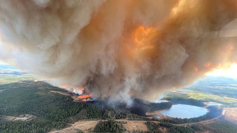 A smoke column rises from wildfire EWF031 near Lodgepole, Alberta, Canada May 4, 2023. Alberta Wildfire/Handout via REUTERS THIS IMAGE HAS BEEN SUPPLIED BY A THIRD PARTY. TPX IMAGES OF THE DAY