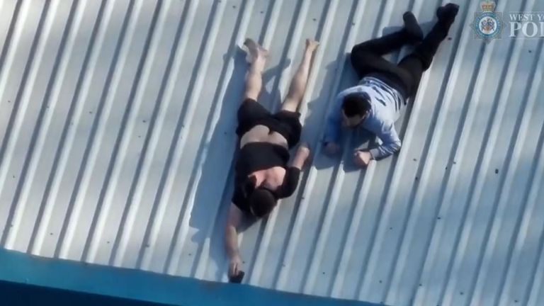 Two men captured trying to ditch phones on roof
