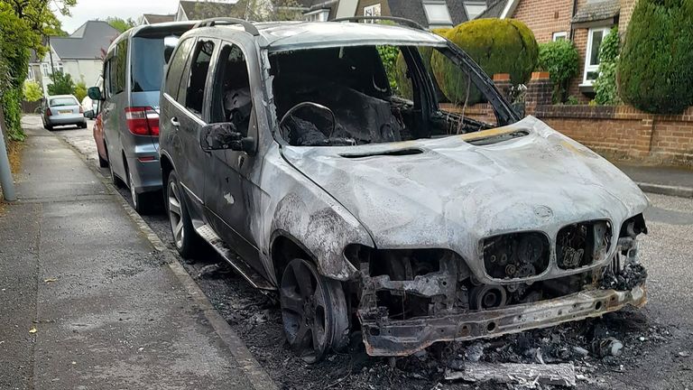 Local residents have described a scene "like a warzone" as police investigate reports of a dozen car fires in the early hours of Monday