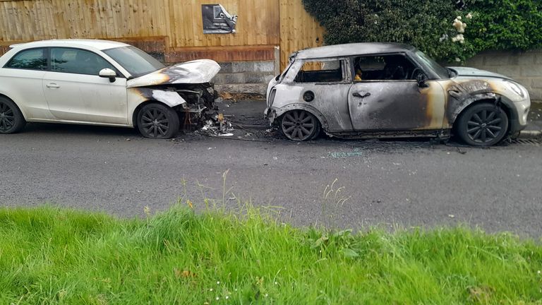 Local residents have described a scene "like a warzone" as police investigate reports of a dozen car fires in the early hours of Monday