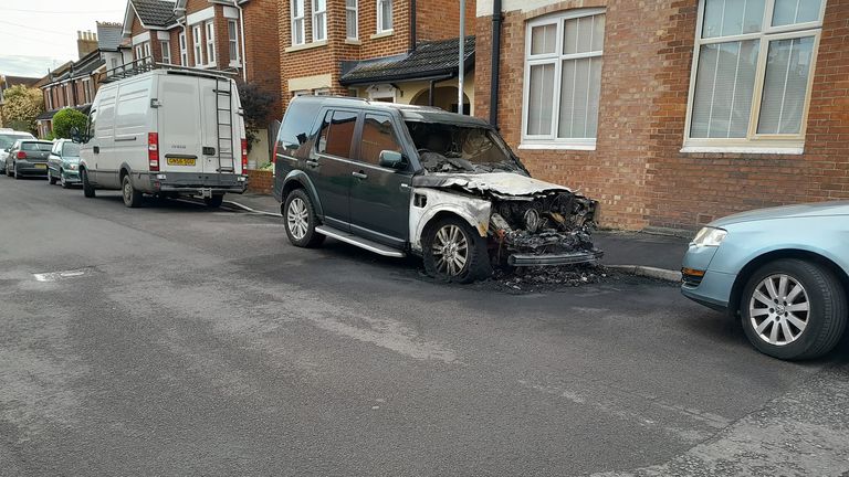 Local residents have described a scene "like a warzone" as police investigate reports of a dozen car fires in the early hours of Monday