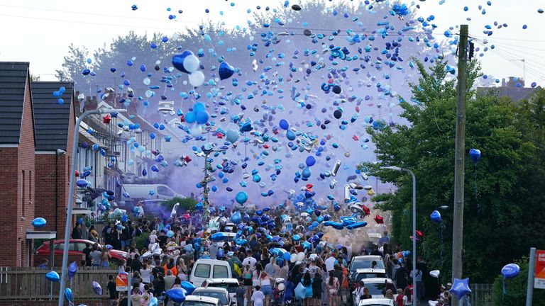 People release balloons during a vigil for the victims of a road traffic collision on Snowden Road in Ely, Cardiff, on Monday. Kyrees Sullivan, 16, and his best friend Harvey Evans, 15, died in a road accident minutes after they had been involved in a pursuit with police, whilst riding an electric bike. Picture date: Friday May 26, 2023.