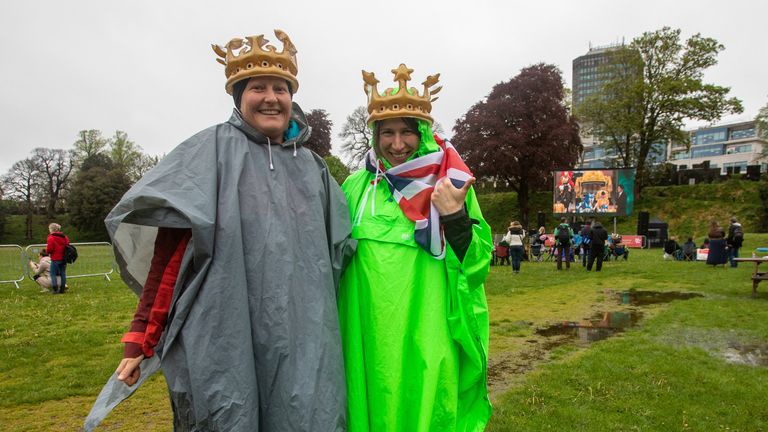 Kasia Slany and Chloe Fisher from London gesture near the Cardiff Castle, Wales, Britain May 6, 2023. They have been camping in Wales and have come to Cardiff Castle to watch Britain&#39;s King Charles and Queen Camilla coronation on a big screen. REUTERS/Joann Randles
