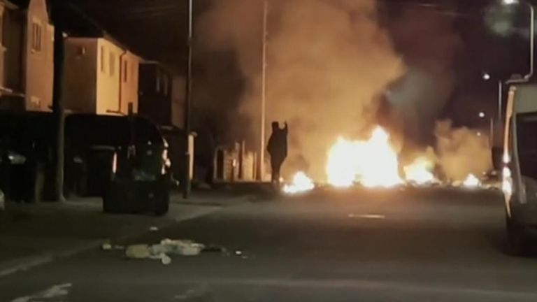 Vehicles are set alight during a riot following a car crash in Cardiff