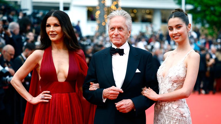 The 76th Cannes Film Festival - Opening ceremony and screening of the film "Jeanne du Barry" Out of competition - Red Carpet arrivals - Cannes, France, May 16, 2023. Michael Douglas, Catherine Zeta-Jones and their daughter Cary pose. REUTERS/Sarah Meyssonnier