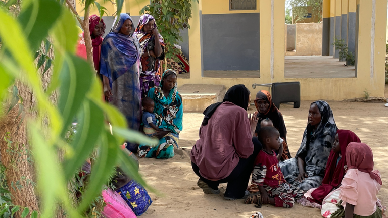  Zeinab, Fatma’s sister and Fatma’s children wait outside the morgue at Adre Central Hospital