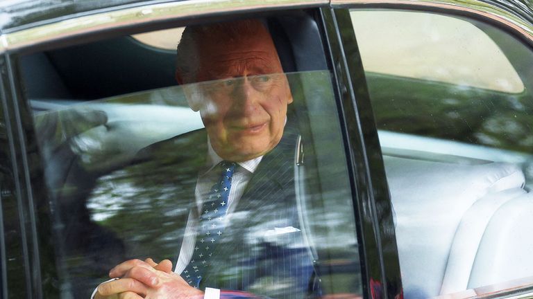 Britain&#39;s King Charles is seen in a car ahead of his coronation  