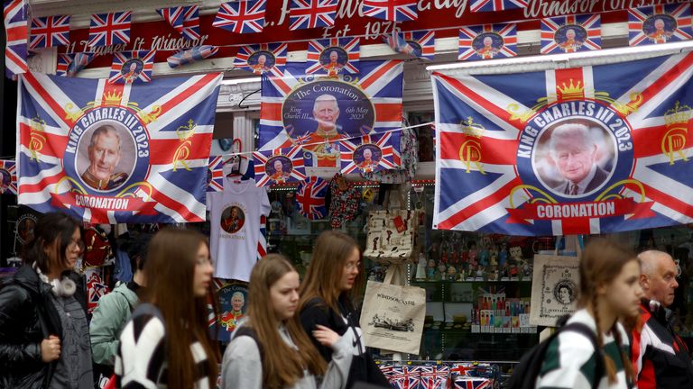 People locomotion  past   a souvenir store  pursuing  Britain's King Charles' coronation, successful  Windsor, Britain, May 8, 2023. REUTERS/Hannah McKay
