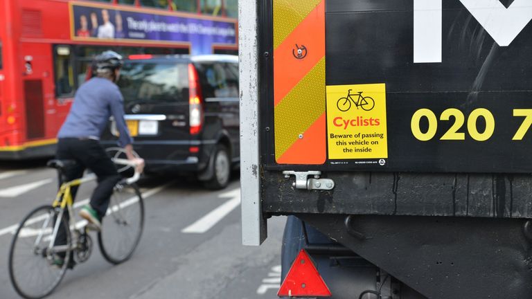 A lorry travels next to a cyclist in London. FILE PIC