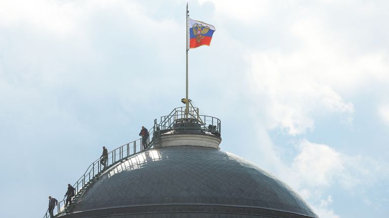 People gather on the dome of the Kremlin Senate building in central Moscow, Russia, May 3, 2023. REUTERS/Evgenia Novozhenina...