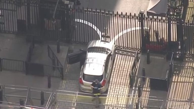 Police at the scene on Whitehall, where a car hit the gates of Downing Street