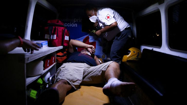 A fan is attended to in an ambulance following a stampede prior to a soccer game between C.D. FAS Vs. Alianza F.C. at the Cuzcatlan stadium, in San Salvador, El Salvador May 20, 2023. REUTERS/ Jose Cabezas