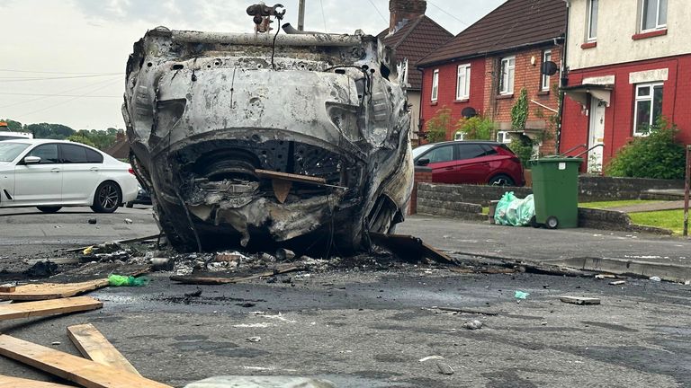 The scene in Ely, Cardiff, following the riot that broke out after two teenagers died in a crash. Tensions reached breaking point after officers were called to the collision, in Snowden Road, Ely, at about 6pm on Monday. Officers faced what they called "large-scale disorder", with at least two cars torched as trouble involving scores of youths flared for hours. Picture date: Tuesday May 23, 2023.