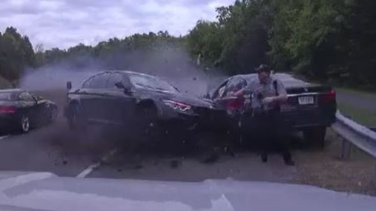 Police officer&#39;s narrow escape when an out-of-control car spun towards him at more than 120mph in Virginia. Pic: Fairfax County Police Department