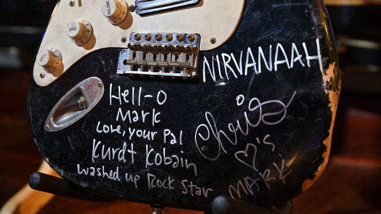  Kurt Cobain&#39;s smashed Nevermind era black Fender Stratocaster electric guitar signed by all three members of Nirvana on display during the Julien&#39;s Auctions Music Icons Preview at the Hard Rock Cafe  