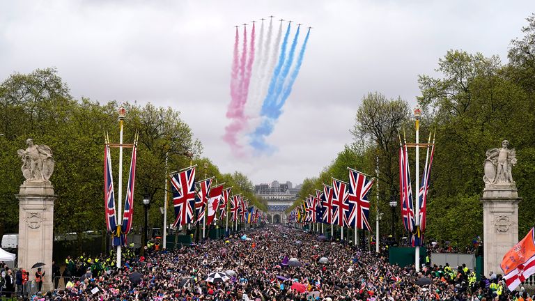 A general view of flypast by aircraft from the Red Arrows over the Mall following the coronation of King Charles III and Queen Camilla in London. Picture date: Saturday May 6, 2023. PA Photo. See PA story ROYAL Coronation. Photo credit should read: Niall Carson/PA Wire