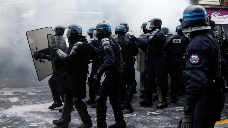 Riot police officers stand guard during the traditional May Day labour march, a day of mobilisation against the French pension reform law and for social justice, in Paris, France May 1, 2023. REUTERS/Benoit Tessier
