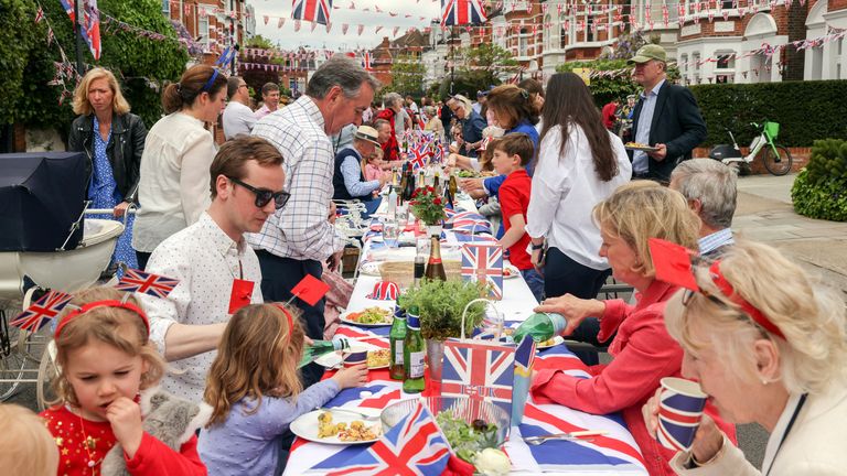 People take part in a Big Lunch event to celebrate the coronation of Britain&#39;s King Charles, in Napier Avenue in Fulham, London, Britain, May 7, 2023. REUTERS/Kevin Coombs

