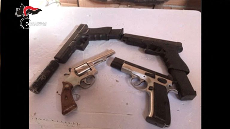 Guns are displayed in an unknown location following an operation of the Carabinieri del Ros and the Provincial Command of Reggio Calabria in Italy and in various foreign countries i